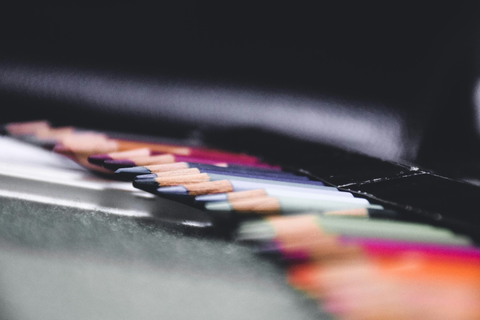 black white and orange coloring pencils